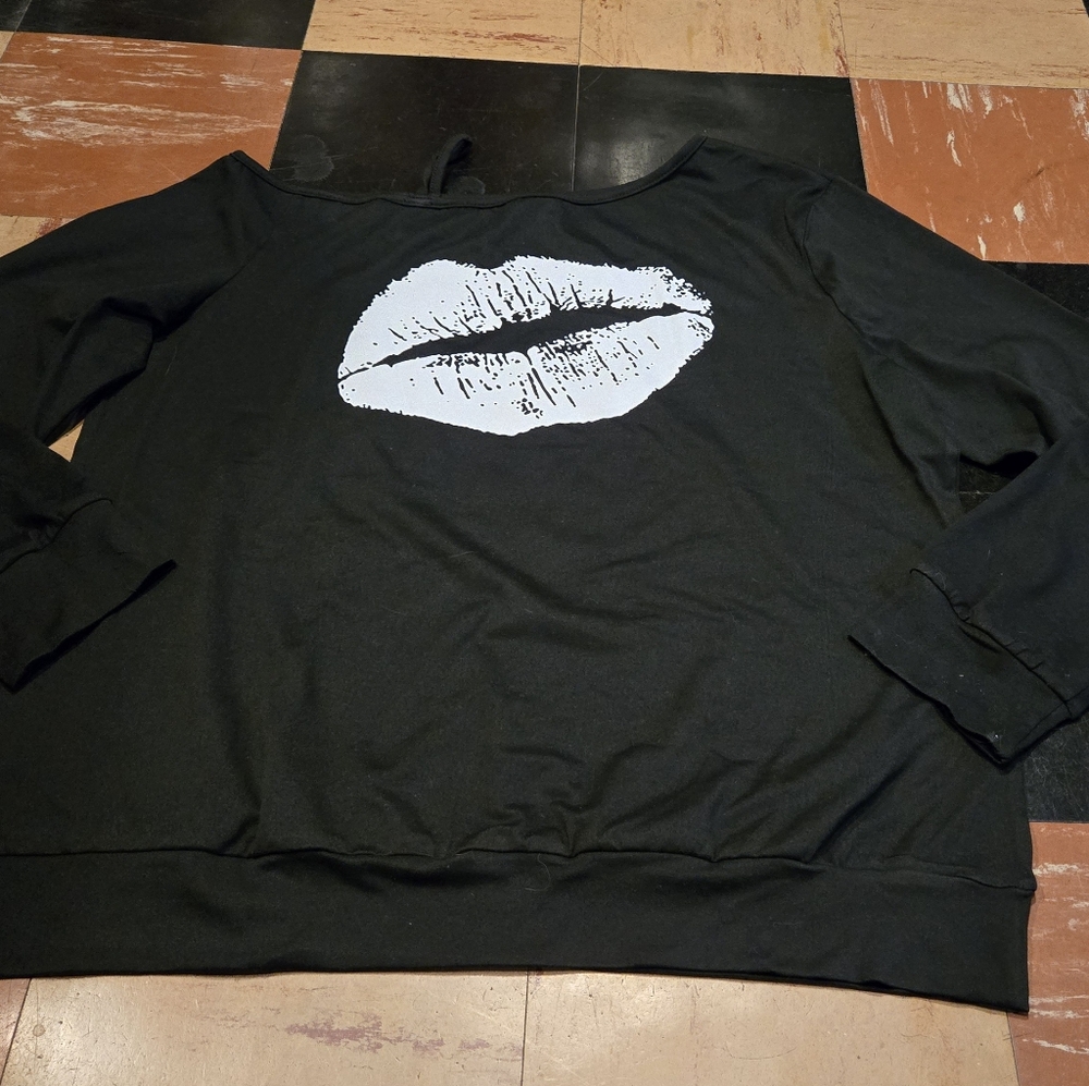 Black and White Off-the-Shoulder Sweater with Bold Lip Design